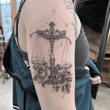 Tattoo mit dem Tierkreiszeichen Waage