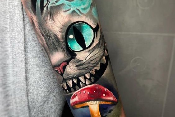 grinsekatze tattoo bedeutung