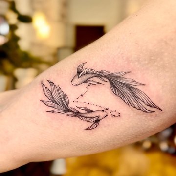 Tätowierung mit dem Sternzeichen Fische