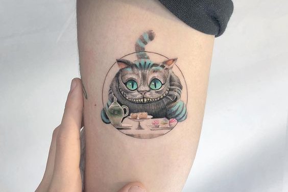 grinsekatze tattoo bedeutung