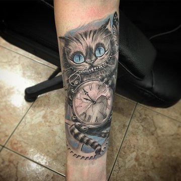 grinsekatze tattoo bedeutung